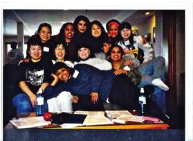 Group of friends posing together indoors.
